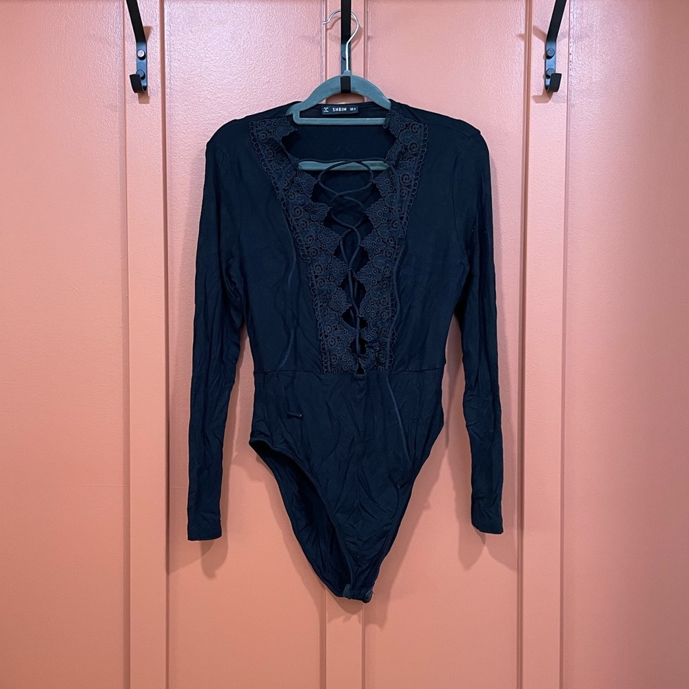 Black long sleeve bodysuit with open tie front detail